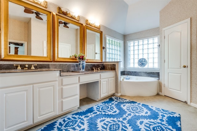 bathroom with vanity and a bathtub