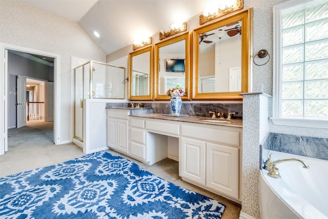 bathroom with ceiling fan, vanity, plus walk in shower, and vaulted ceiling