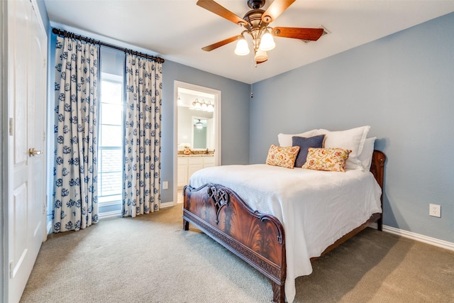 bedroom featuring ceiling fan, ensuite bath, and carpet flooring