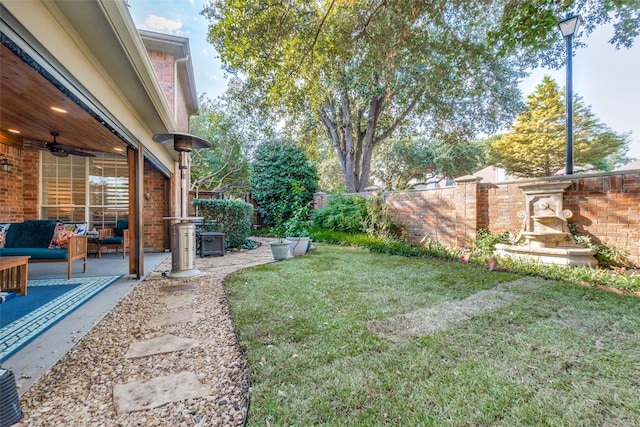 view of yard with ceiling fan, an outdoor hangout area, a patio area, and central air condition unit