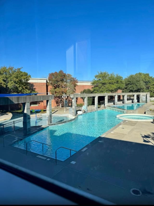 view of swimming pool featuring a patio