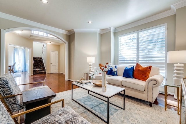 living room featuring crown molding and hardwood / wood-style floors