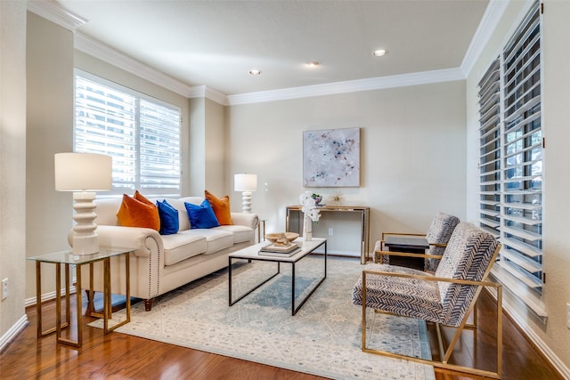 living room featuring hardwood / wood-style flooring and ornamental molding