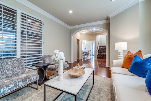 living room with hardwood / wood-style flooring and ornamental molding