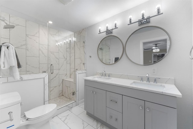 bathroom featuring toilet, ceiling fan, walk in shower, and vanity