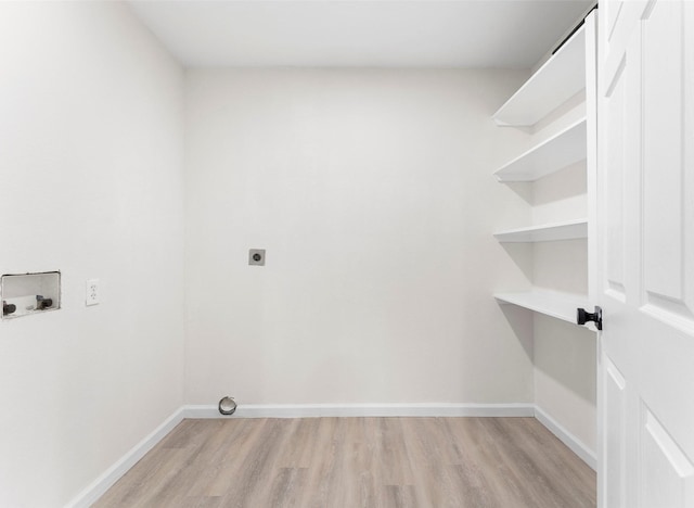 washroom with washer hookup, light hardwood / wood-style flooring, and electric dryer hookup