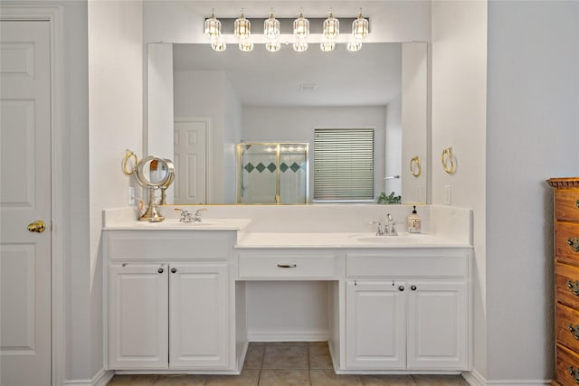 bathroom with tile patterned floors, a shower with shower door, and vanity