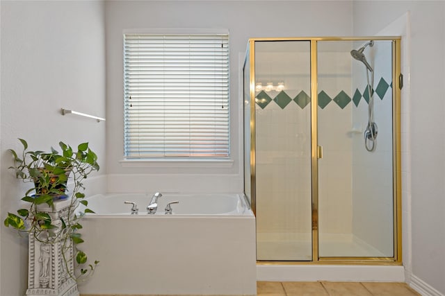 bathroom with tile patterned floors and plus walk in shower