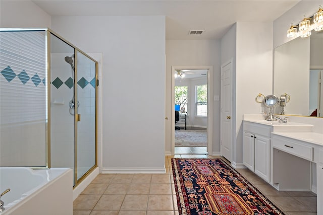 bathroom featuring tile patterned flooring, vanity, independent shower and bath, and ceiling fan