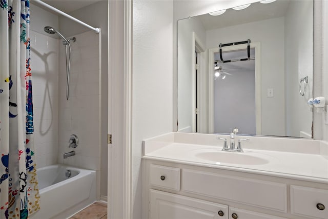 bathroom with vanity, shower / bathtub combination with curtain, and tile patterned floors