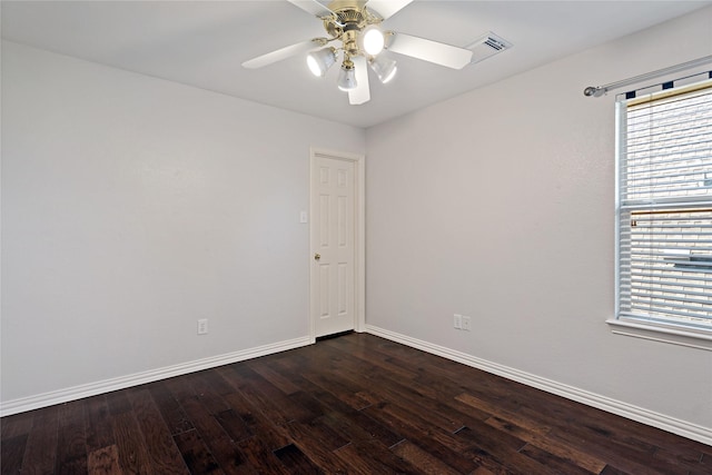 unfurnished room featuring ceiling fan and dark hardwood / wood-style flooring