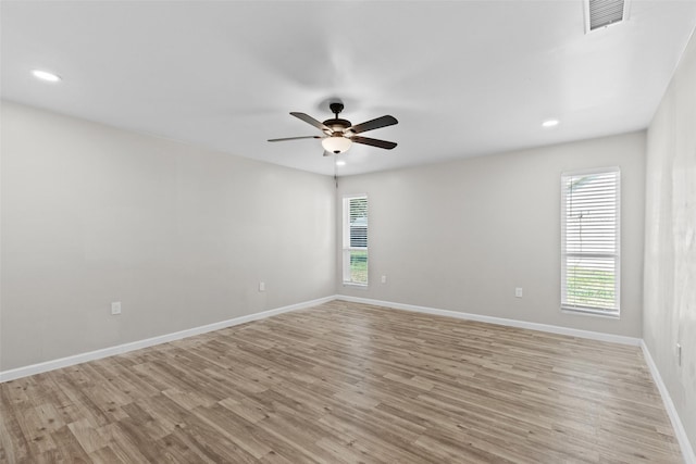 unfurnished room featuring light hardwood / wood-style floors and ceiling fan