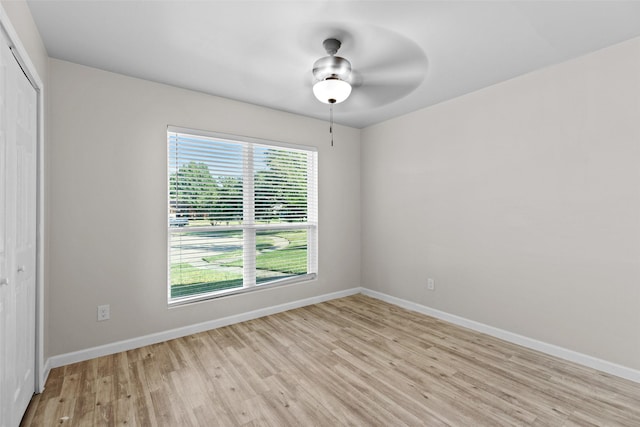 unfurnished room featuring light wood-type flooring and ceiling fan