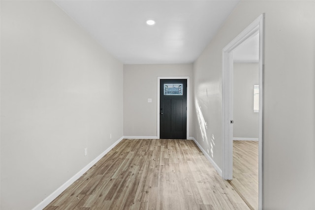 foyer entrance with light hardwood / wood-style flooring