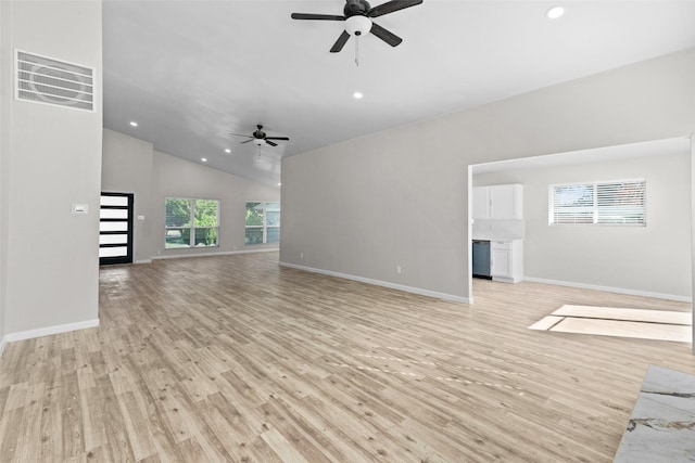 unfurnished living room featuring ceiling fan, light wood-type flooring, and vaulted ceiling