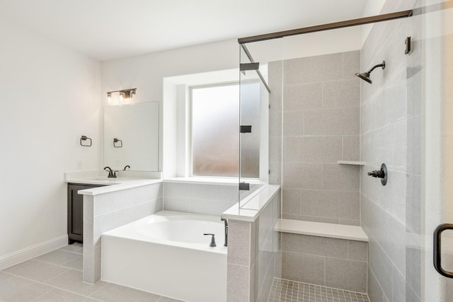 1217 Sylvia St, Desoto, TX 75115 - full bathroom with a stall shower, a garden tub, tile patterned flooring, vanity, and baseboards