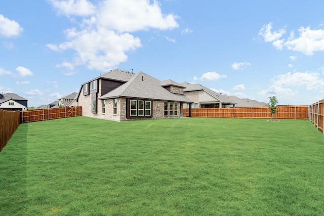 1217 Sylvia St, Desoto, TX 75115 - rear view of house with a shingled roof and brick siding