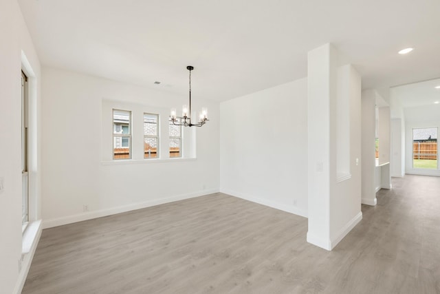 1217 Sylvia St, Desoto, TX 75115 - unfurnished room featuring plenty of natural light, light wood-style floors, a chandelier, baseboards, and recessed lighting