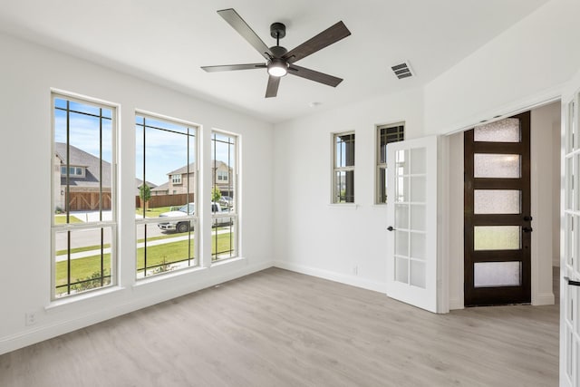 1217 Sylvia St, Desoto, TX 75115 - unfurnished room with light wood finished floors, baseboards, and a ceiling fan