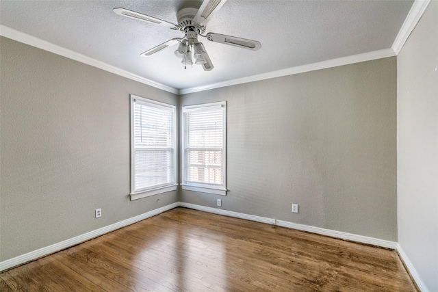 unfurnished room featuring ceiling fan, ornamental molding, and hardwood / wood-style flooring