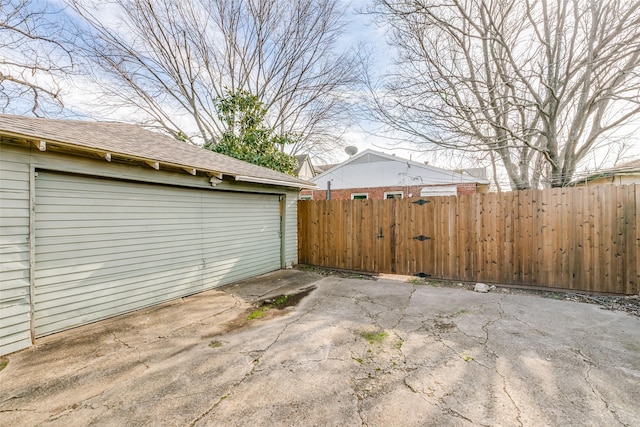 exterior space with a garage and an outdoor structure