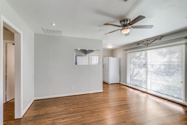 spare room with ceiling fan and wood-type flooring