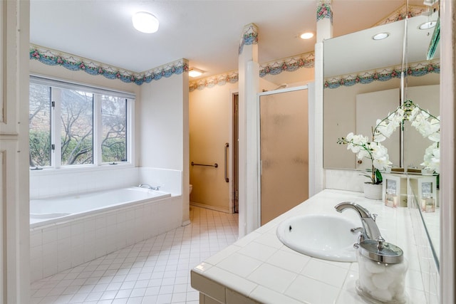 bathroom featuring tile patterned flooring, vanity, and independent shower and bath