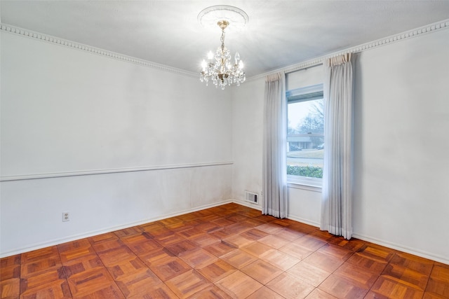 empty room featuring an inviting chandelier and parquet floors