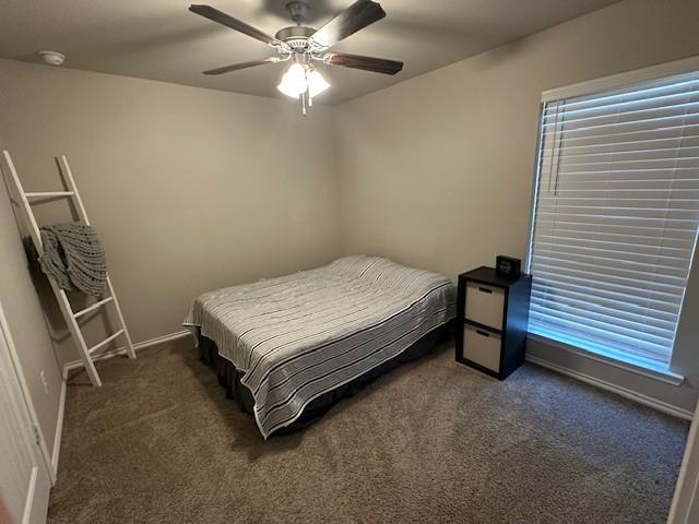 carpeted bedroom featuring ceiling fan