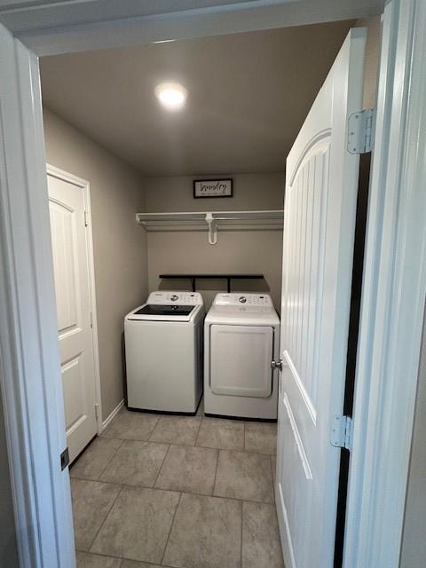 clothes washing area with independent washer and dryer