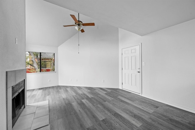 unfurnished living room with ceiling fan, a fireplace, dark hardwood / wood-style flooring, and lofted ceiling