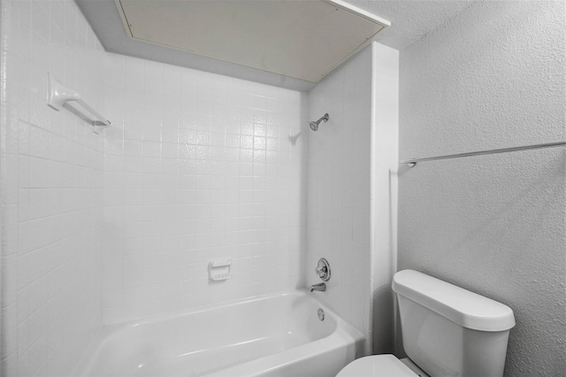 bathroom featuring toilet and shower / tub combination