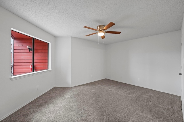 unfurnished room featuring carpet floors, ceiling fan, and a textured ceiling