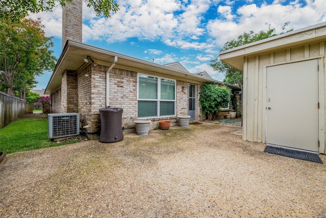 back of property featuring a patio and central air condition unit