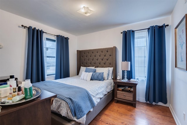 bedroom featuring wood-type flooring