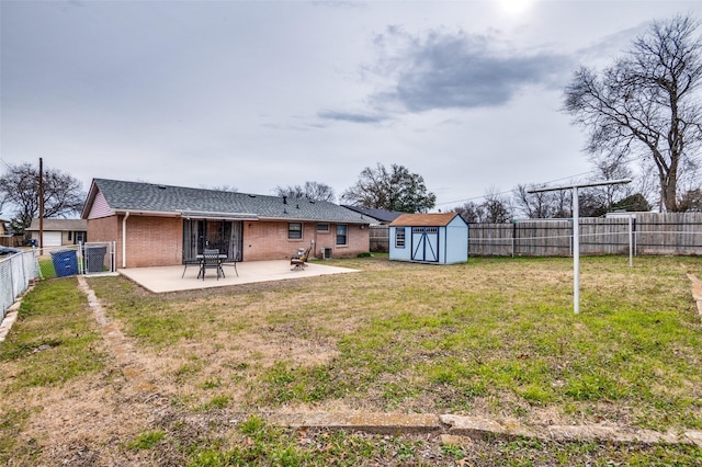 view of yard featuring a shed and a patio