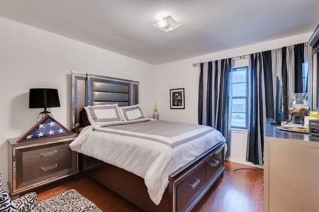 bedroom featuring dark hardwood / wood-style floors