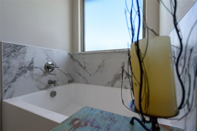 bathroom with a garden tub