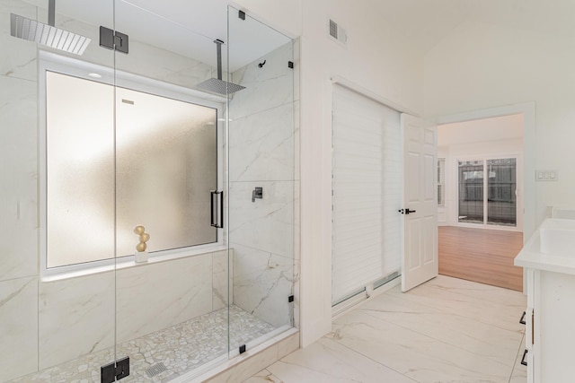 bathroom with vanity and an enclosed shower