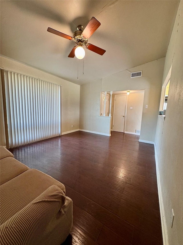 bedroom featuring a ceiling fan, visible vents, dark wood finished floors, and baseboards