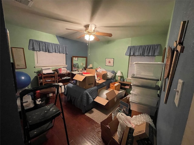 interior space featuring ceiling fan and dark hardwood / wood-style flooring