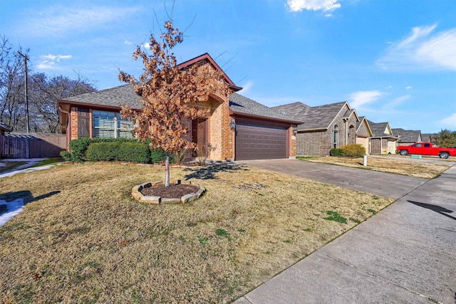 view of front of home featuring a front lawn and a garage