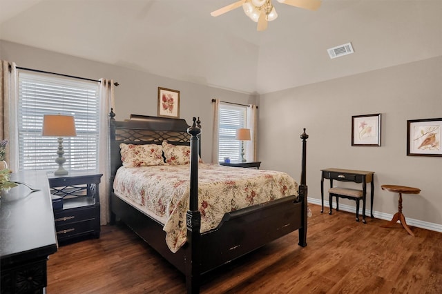 bedroom with ceiling fan, dark hardwood / wood-style flooring, and vaulted ceiling