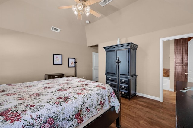 bedroom with ceiling fan, connected bathroom, dark hardwood / wood-style floors, and lofted ceiling