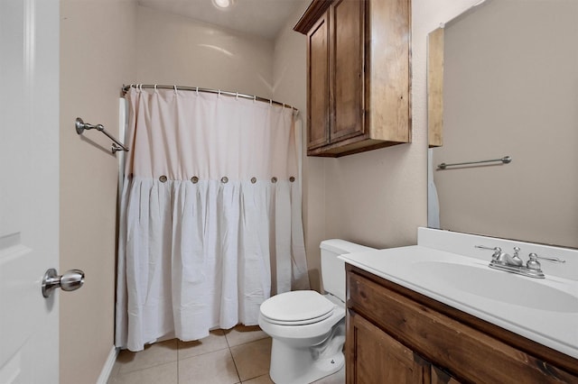 bathroom featuring curtained shower, toilet, vanity, and tile patterned flooring