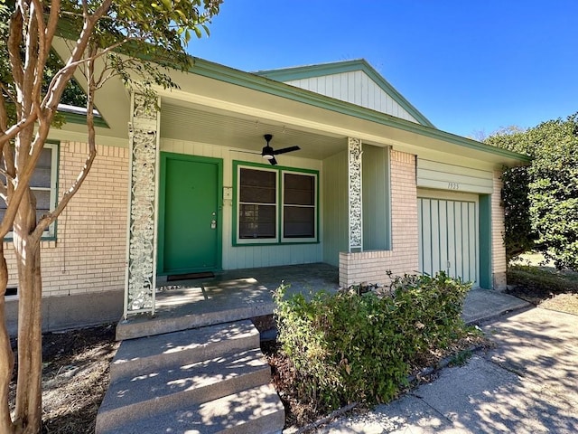 view of exterior entry with covered porch and ceiling fan