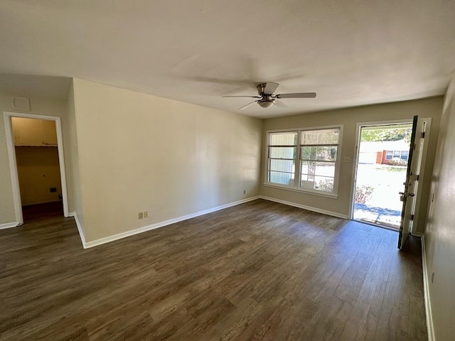 unfurnished room featuring ceiling fan and dark hardwood / wood-style floors