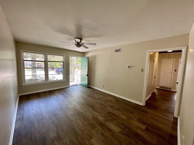 empty room featuring ceiling fan and dark hardwood / wood-style floors