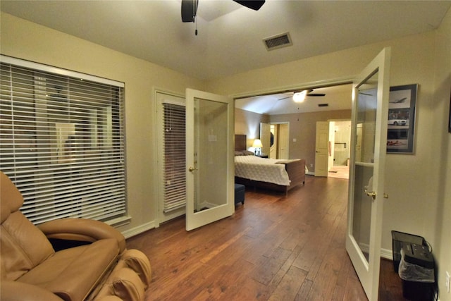 bedroom featuring dark wood-type flooring and ceiling fan