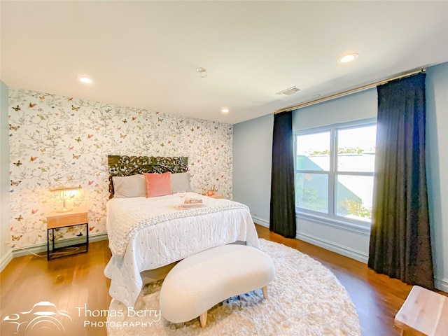 bedroom with hardwood / wood-style flooring